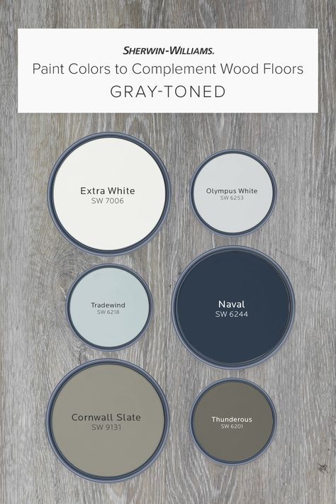 If your wood floors are gray-toned, this palette from Sherwin-Williams can help you pick a wall color to complement them perfectly. Tap this pin to learn why hues like Extra White SW 7005, Naval SW 6244, Cornwall Slate SW 9131, and others can help bring classic charm, bold drama, and more. #sherwinwilliams #woodfloors #graywoodfloors #paint #painting #diy #interiordesign #decor Gray Wood Floors Color Scheme, Barndo Kitchen Ideas Modern, Paint That Matches Dark Wood, Gray Floor Furniture Ideas, Navy Walls Light Wood Floors, Navy Paint Palette Colour Schemes, Blue Grey Carpet Bedroom, Classic Blue Paint Colors, How To Style Gray Floors