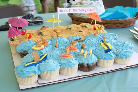 Beach themed cupcake display Beach Cupcake Cake, Beach Bday, Ocean Cupcakes, Beach Theme Cupcakes, Beach Cupcakes, Theme Cupcakes, Aloha Party, Cupcake Wars, Cupcake Cake Designs