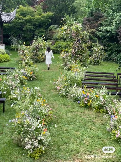 Overgrown Aisle Flowers, Wildflower Ceremony Isle, Cottagecore Wedding Ceremony, Flower Path Wedding, Overgrown Wedding Aisle, Forest Flower Wedding, Wildflower Wedding Ceremony Aisle Decorations, Ground Floral Ceremony, Wedding Flower Isle