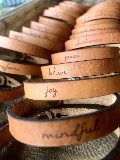 "SUMMER VACATION SALE Shipping times are longer while we enjoy time with our family! Enjoy a little discount on our skinny bracelets as a thank you for your patience. Be Inspired all Day. Jewelry with meaning. Skinny Full Grain Leather Bracelet Engraved with a word or words of your choice. Makes a wonderful gift reminder to someone you love! Choose a word or customize one with your own words! (For your own words... Choose custom & add your words in the personalization box.) This Classic styl Ladies Leather Bracelets, Burning Leather Ideas, Leather Engraving Ideas, Engraving Ideas Jewelry, Engraved Crafts, Leather Bracelet Ideas, Engraved Gift Ideas, Diy Leather Gifts, Laser Products