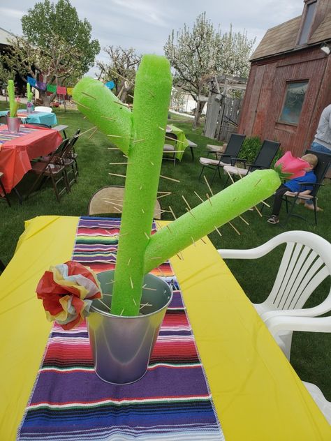 DIY cactus centerpieces. Fun. Easy. Cheap. #fiesta decor Use pool noodles, cut into pieces (this one is 2',1' & 6"). Could go smaller if you want. Hot glue pieces together. Add toothpicks the place in a bucket or terracotta pot, I glued it to. use sand or small rocks to weigh down the bucket. Pool Noodle Cactus, Cactus Centerpiece, Cactus Diy, Fiesta Theme Party, Fiesta Theme, Pool Noodles, Terracotta Pots, Hot Glue, Wedding Party