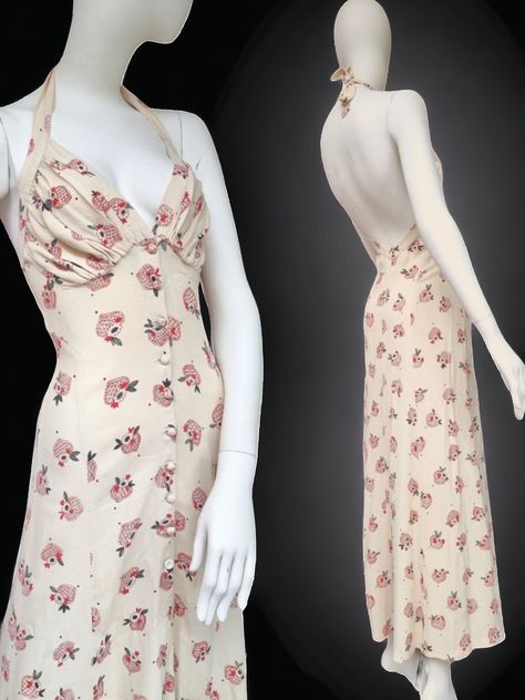 Totally in love with this Rare print Vintage 1970s Ossie Clark at Radley  Oatmeal Moss Crepe maxi with Celia Birtwell print l! Beautiful Cream/Oatmeal Moss Crepe Halter Neck dress cut in the way Ossie did best...low back, shaped bust and button up front so you can open as far as you like! Print comprises of a doodled heart in red with pretty flower and leaf detail..both in Black and Red Bust is lined and all buttons are present. Great condition. Totally wearable as is, but as in a lot of Ossie Clark dresses theres a few issues as they were made to be worn for fun! Firstly theres very faint marks here and there . Ive dry cleaned it twice which has helped but maybe another go might help? The print has very slight fade as well.  Theres a small mend on the back of the skirt back that looks to Celia Birtwell, Ossie Clark, Button Front Maxi Dress, Maxi Dresses Uk, Halter Neck Dress, Silhouette Ideas, Pretty Flower, Halterneck Dress, Dress Cuts