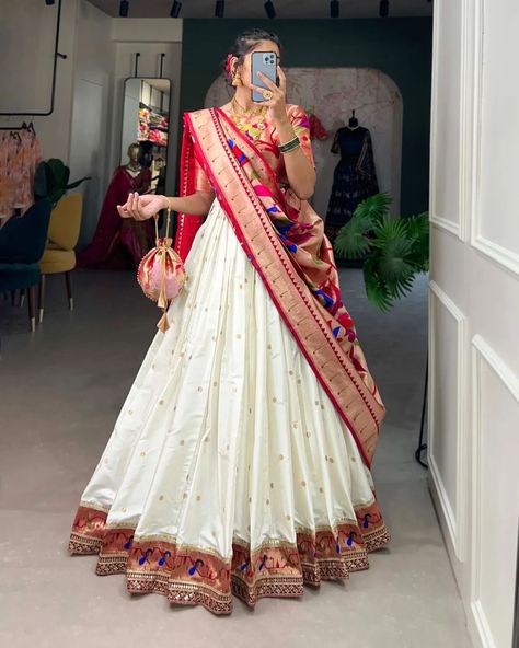 Who says you can't be trendy and traditional at the same time? 🤷🏻‍♀️ This Jacquard Silk Paithani Lehenga Choli is the perfect classic and contemporary fashion🧡🤍 *Catalogue : RUDRANI* *LNB2005ONG* *LNB2005WHT* *Lehenga(Stitched)* Lehenga Fabric : Jacquard Silk (Paithani) Lehenga work : Weaving Zari Work Lehenga Waist : SUPPORTED UP TO 42 Lehenga Closer : Drawstring with Handmade Tassels Stitching : Stitched With Canvas and Can Can Length : 41 Flair : 4 Meter Inner : Micro Cotton *Blous... Indian Style Dress, Paithani Lehenga, Silk Half Saree, Saree Function, Half Saree Function, South Indian Style, Half Saree Lehenga, Half Saree Designs, Indian Lehenga