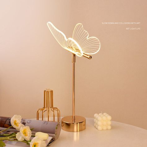 Retro bedroom bedside table lamp crystal glass butterfly night light decorative atmosphere table lampProduct Details -Name: Butterfly Flower Table Lamp -Material: metal + acrylic -Size: 17*17*45cm -Style: butterfly, sunflower, double-layer butterfly, four-leaf clover, silver wire butterfly -Voltage: 110V~240V Plug-in -Light source: LED 5W -Function: The lamp head can be adjusted 180°, three-color light change -Package: 1/bagRecommended purchase Toaster Emotional Lamp Lily Flower Table Lamp Butterfly Room Decor Bedroom Ideas, Table Decorations Bedroom, Flowers For Bedroom, Bedroom Table Decor, Things For Your Room, Sunflower Lamp, Cute Desk Lamp, Wire Butterfly, Butterfly Lamp