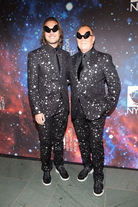 Michael Kors and his husband Lance LePere made a striking pair, smartly dressed in star-speckled suits and bug-eyed alien shades. With his fashion-forward thinking, Kors serves as judge of the costume contest and is continually amazed by the looks year after year. "What's the craziest thing?" he recalls. "I think, one year, a guy came as a disco ball and then he spun around the cocktail party." Space Cowboy Costume Men, Space Party Costumes, Nye 2024, Space Disco, Bug Costume, Space Costumes, Party Outfit Men, Frankie Grande, Best Costumes