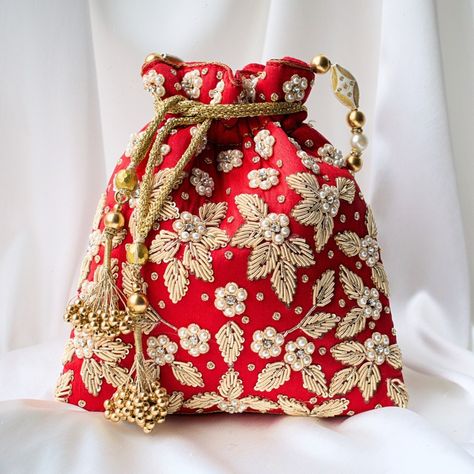 Make a statement with our show stopping CHAYA Potli Bag. A very unique piece embellished with beautiful zardozi, pearls and sequins. not given not given Silk Fancy Clutch Purse, Embroidered Hair Bows, White Hair Bows, Bridal Handbags, Wedding Handbag, Potli Bag, What Do, Motifs Perler, Potli Bags