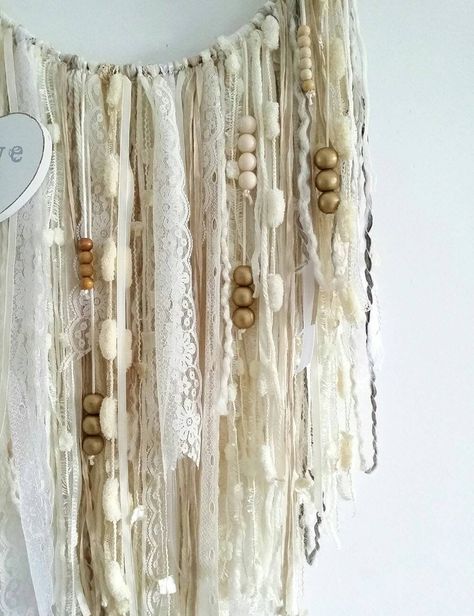 This handmade boho dream catcher wall hanging is a perfect way to add a vintage bohemian touch to your home. Ideal to decorate any boho bedroom as well as being part of a nursery decor. Surprise a friend as a romantic wedding gift or a new baby gift for the mother to be! This large dreamcatcher features different types of yarn and laces in a variety of textures in cream and off white colors so that to match perfectly with almost any decor. Decorated as well with wooden beads and a wooden heart o Yarn Wall Decor, Doily Dream Catchers, Bedroom 2024, Boho Crafts, Boho Yarn, Boho Dream Catcher, Bohemian Dreamcatcher, Dream Catcher Wall Hanging, Macrame Tutorials