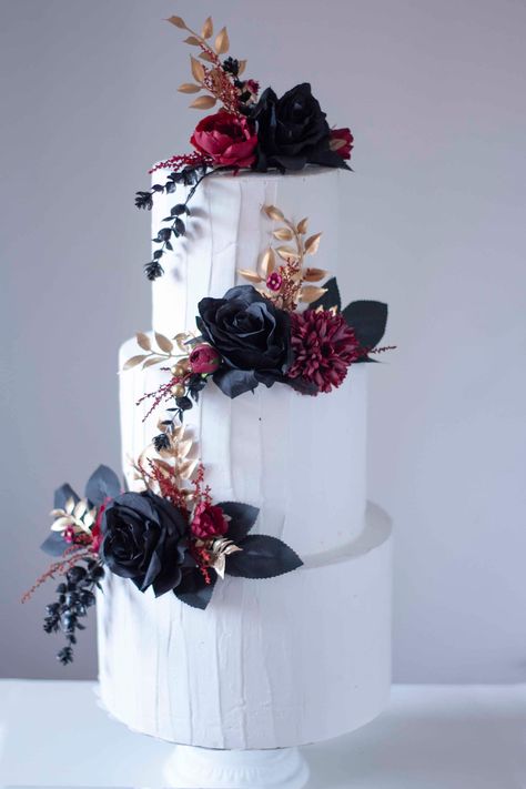 Floral cake topper in black, gold and burgundy colors ideal for black weddings, Halloween or any other event with this color palette. The cake in the image measures 45 cm high by 25 centimeters wide. The flowers are made of fabric and plastic and inedible. You can buy each style separately or purchase the full set that includes the 3 styles that appear in the image. The colors of the flowers can be substituted if you wish, just contact us before placing your order. The delivery times are: Peninsular Spain: 1 to 3 days. Spain Islands: 5 to 10 days. Europe: Between 5 and 10 business days. America: Between 10 and 20 business days. If you need your order more urgently, you can purchase our store tab called expedited shipping along with your order. I leave you a link below. https://www.etsy.com Dark Themed Wedding Cake, Wedding Cake With Dark Flowers, Black Rustic Wedding Cake, Tim Burton Wedding Cake, Dark Floral Wedding Cake, Black Burgundy And Gold Wedding Cake, Goth Wedding Cake Victorian Gothic, White Cake With Black Flowers, Dark Wedding Cake Ideas