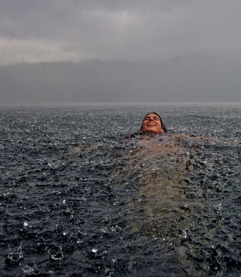 Swimming in the Rain - Lago Caburgua, Chile. Photo by Camila Massu Ocean Swim Aesthetic, Swimming In Nature, Ocean Swimming Aesthetic, Sea Swimming Aesthetic, Favourite Aesthetic, Photos In The Rain, Floating In The Ocean, Swimming Ocean, Ocean Swimming