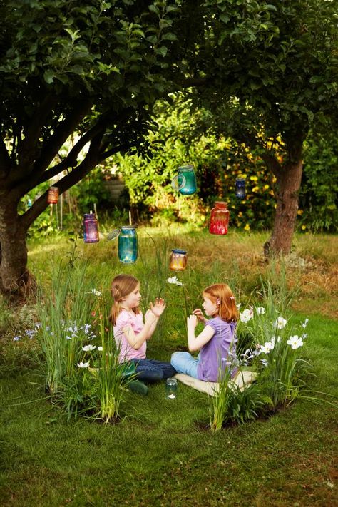 15 magical fairy gardens for kids including one kids can actually get INSIDE. I love the wagon turned fairy garden, too! Outdoor Kids Play Area, Hgtv Garden, Play Garden, Trees And Flowers, Fairy Lanterns, Fairy Ring, Faeries Gardens, Children's Garden, Secret Gardens