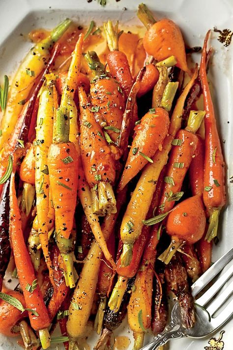 Formal: Orange-Ginger-Chile-Glazed Carrots | We’ve done the meal planning for you: take your pick from casual, classic, and formal Christmas Eve dinner menus. Whether your crowd prefers a casual holiday meal or a formal sit-down affair, we have menu ideas for every type of Christmas Eve dinner. Whichever menu you choose, these delicious dishes will put everyone in a festive mood. Christmas Eve Dinner Menu, Christmas Dinner Side Dishes, Christmas Dinner Sides, Christmas Side Dish Recipes, Vegetarian Christmas, Christmas Sides, Christmas Side Dishes, Christmas Dinner Menu, Christmas Eve Dinner