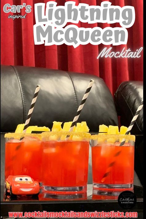 This image shows three red drinks with a yellow rim, pineapple garnish and black and white striped straws in a home movie theater with a Lightning Mcqueen car sitting next to them. Disney Themed Drinks, Disney Movie Night Menu, Disney Themed Movie Night, Disney Movie Night Food, Disney Movie Night Dinner, Disney Inspired Food, Movie Night Dinner, Movie Night Food, Disney Drinks