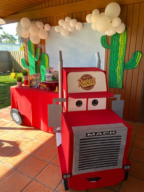 Diy Cars Birthday Party, Mac Truck From Cars, Cars Disney Party Ideas, Mack From Cars Cardboard, Cars Fourth Birthday, Cars Birthday Party Backdrop, Mater Birthday Party Ideas, Cars Themed Graduation Party, Cardboard Lightning Mcqueen