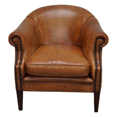 This cognac-colored leather club chair comes from the Netherlands. It is upholstered with cognac-colored leather and features metal rivets and wooden legs. Hacienda Interior Design, Leather Club Chairs, Color Club, Club Chair, Colored Leather, Camel Color, Chairs For Sale, Bits And Bobs, Tub Chair