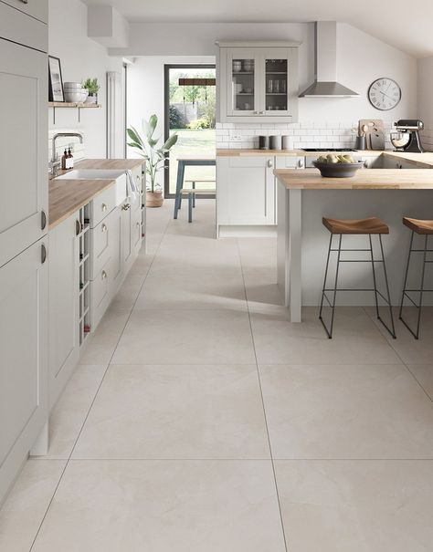 Introducing our exquisite Capri Travertine Stone porcelain floor tiles, a perfect blend of sophistication and durability for your home. Crafted with meticulous attention to detail, these tiles add a touch of class to any room and create a seamless and expansive look for your home. Resistant to stains, scratches, and wear, these tiles offer both style and practicality, making them an ideal choice for high-traffic areas. Elevate your home with the versatility and charm of these premium porcelain floor tiles.  Capri Travertine Stone boasting a soft, neutral hue that effortlessly complements various design aesthetics and seamlessly blends sophistication with durability.     Available in 60cm x 60cm and 80cm x 80cm tile sizes. Kitchen Floors Ideas Tile, Open Plan Tiled Floor, White Kitchen With Travertine Floors, Neutral Interior Design Kitchen, Japandi Kitchen Floor Tiles, Kitchen Floor Tile Design Ideas, Cream Kitchen Floor Tiles, Kitchen With Stone Floor, Stone Colour Kitchen