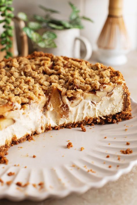 This apple crumble cheesecake is made with a biscoff cookie crust, creamy spiced cheesecake topped with tender cinnamon apples, and a crumble topping. It's the perfect rich and delicious Fall cheesecake! #applecrumble #cheesecake #fallbaking | teakandthyme.com Apple Crumble Cheesecake With Biscoff Crust, No Bake Apple Crumble Cheesecake, Apple Crumble Cheesecake No Bake, Easy Apple Cheesecake, Apple Crumb Cheesecake, Spiced Cheesecake, Biscoff Crust, Fall Cheesecake, Apple Crumble Cheesecake