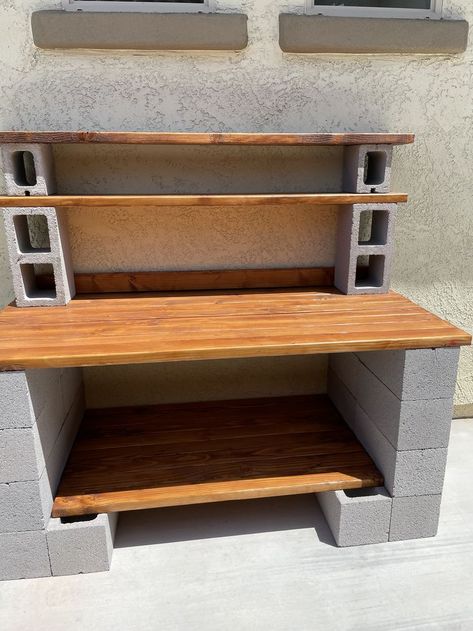 Potting Bench Cinderblock, Cinder Block Potting Bench Ideas, Cinder Block Cooking Station, Spray Paint Cinder Blocks, Cinder Block Work Bench, Cinder Block Tables Outdoor, Cinder Block Garden Bench, Diy Cinder Block Plant Stand, Cinderblock Diy Projects