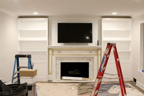 White Built-Ins Around the Fireplace: Before and After | The DIY Playbook White Built Ins, Built In Around Fireplace, Built In Bookshelves, Fireplace Bookshelves, Built In Shelves Living Room, Living Room Built Ins, Built In Cabinet, Fireplace Built Ins, Decor Fireplace