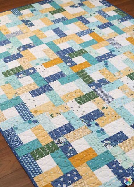 Wrap Around quilt pattern - a free pattern and tutorial by Andy Knowlton of A Bright Corner quilt blog. Perfect charm square quilt pattern Quilt Patterns Using Squares And Rectangles, Jelly Roll And Charm Pack Quilt Patterns, Around The Block Quilt Pattern, Jelly Roll Scrap Quilts, Jellyroll Quilts Patterns Free Easy, Quilts Made With Jelly Rolls, Free Scrappy Quilt Patterns, Jelly Roll Quilt Patterns Free Tutorials, Brightly Quilt Pattern