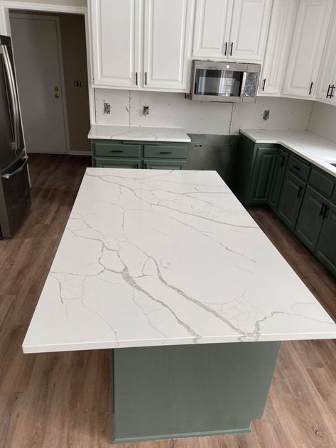 Calacatta Laza Quartz Countertops. This beautiful quartz has a bright white base with warm veining to create eye-catching designs. 

#Vicostone, #Hanstone, #Daltile, #GSgranite, #Silestone, #Caesarstone, #Wilsonart #Cosentino #AmsumAsh #PrimusStone #quartz #granite #quartzite #marble #countertops #stonecountertops #kitchencountertops #design #homeremodeling #designideas #moderndesign #customhome #quartzcountertops #minnesotacountertops #remodeling #kitchnenisland #designinspo #quartzfabricator Calacatta Laza Quartz Kitchen, Calacatta Laza Quartz, Calacatta Laza, Kitchen Finishes, White Kitchen Remodeling, Painting Countertops, Quartz Kitchen Countertops, New Countertops, Future Apartment Decor