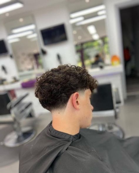 Tapper Fade Men Haircut Curly Hair, Under Cut For Boy, Taper Fade Haircut Wavy Hair, Blowout Taper Men Wavy Hair, Low Taper Back, Skin Taper Fade Men, Low Mid Fade Haircut Men, Low Taper Fade Fluffy Hair, Low Taper Fade Haircut Wavy Hair