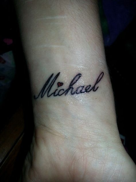 My husband's name Michael Tattoo. On my wrist. Micheal Tattoo Name, Michael Name Tattoo Design, Mike Name Tattoo Design, Tattoo Name With Heart, Michael Tattoo Name Fonts, Small Boyfriend Name Tattoos For Women, Tattoo Name On Wrist, Michael Name Tattoo, Michael Tattoo Name