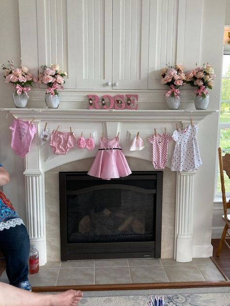 Baby Shower for Baby Rose. Mantle Decorations. Clothes garland were gifts from the hostess. Baby Shower Fireplace Mantle, Baby Clothes Baby Shower Decor, Baby Shower Staircase Decor, Baby Clothes Garland, Fireplace Baby Shower Decor, Baby Shower Fireplace Decor, Baby Shower Diaper Ideas, Clothesline Baby Shower Decor, Rose Themed Baby Shower Ideas