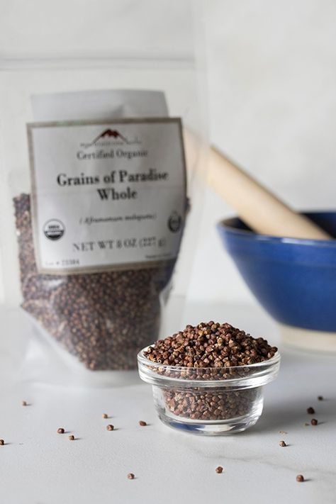 glass bowl filled with grains of paradise spice with bag of grains of paradise and mortar and pestle Grains Of Paradise, Ginger Family, Drinks And Food, Mountain Rose, Bombay Sapphire, Mountain Rose Herbs, Juniper Berry, Dry Rub, Flavored Drinks