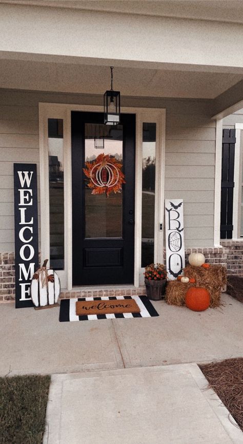 Loving my front porch this year! Here's everything included: 
Custom-made black and white welcome sign
'Boo' sign from Bealls Outlet
Ornage wreath from Amazon
Pumpkin on wreath from Big Lots
Wood Pumpkin from Hobby Lobby
Welcome mat from Amazon
Striped rug from Amazon
Hay Bales from Hobby Lobby
Mums and pumpkins from Home Depot

minimalist fall decor for front porch Pumpkins Small Front Porch, Black White Fall Porch, Small Porch Mum Decor, Black White And Orange Fall Decor Porch, Halloween Decorations Hobby Lobby, Fall Front Porch Rug, Hay Porch Decor, Mums Pumpkins Front Porch, Halloween Door Step Decor