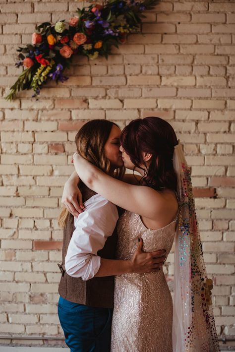 Two brides | queer wedding | lesbian wedding rainbow wedding cake with sprinkles | pinball date | wedding veil with sequins | rainbow wedding veil | champagne wedding gown | rainbow wedding flowers | custom cookies for LGBTQ+ couple | custom cocktail ideas for weddings | wedding cocktails | colorful photo booth idea for wedding reception | Samantha Joy Photo Western Lesbian Wedding, Trans Wedding Ideas, Outdoor Lesbian Wedding, Lesbian Wedding Color Schemes, Lesbian Country Wedding, Queer Wedding Ideas, Rainbow Wedding Flowers, Sapphic Wedding, Lesbian Wedding Outfits