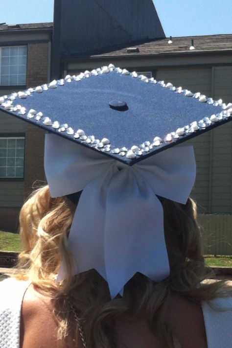 Graduation cap! College Grad Cap Ideas Simple, Bow Cap Graduation, Grad Caps With Bows, Hat Graduation Decoration, Simple Cap Ideas For Graduation, Pink Rhinestone Grad Cap, Extra Graduation Cap, Graduation Cap Designs With Pearls, Graduation Cap Designs Royal Blue