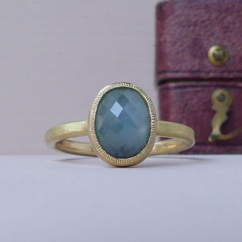 The Ocean ethical engagement ring has a deep and mysterious quality, like the water she is named after. She’s one-of-a-kind and perfect if you are looking for a unique alternative to the high street. Tiny stamped lines surround the inky blue Malawi sapphire (3.09 carats) set in a gently hammered gold band. Ocean has been handmade with 18ct Fairtrade gold from small scale miners in Peru, enabling them a fair income and a safeguard against the natural dangers of mining. Ethical Engagement Ring, Hammered Gold, Unique Diamonds, Precious Jewelry, Gold Band, Conflict Free Diamonds, Rose Cut, Gold Bands, The Ocean