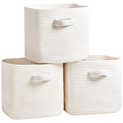 Made from soft, eco-friendly cotton material, this woven cube storage box ensures the comfort and safety of every member of your family. Say goodbye to flimsy baskets that collapse easily because this high-quality cotton storage basket holds its shape perfectly and offers unparalleled durability. Color: White | Latitude Run® Fabric Storage Bin Fabric in White | Wayfair | Organization Bedroom Storage Ideas Organizations, Baskets For Shelves Storage Ideas, Clothes Storage Bins, Basket For Storage, Bookshelf Storage Bins, Baskets For Closet Storage, Cute Storage Baskets, Closet Organization Boxes, Cute Storage Containers