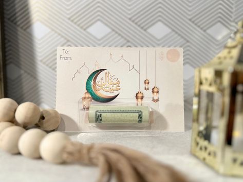 "Lets make this Eid memorable by giving Eidi in this fun creative way!  -Eid money cards- You can purchase 1 for $4.89   or set of 6 for $25! Money card details: - Card size - 4\" x 6\" - Clear plastic domes with adhesive backings size 3.25x1.25 - Made from high quality Cardstock paper All you will have to do is roll the money, place it in the plastic holder, peel off the backing tape, and stick it on the card  *Money NOT included* *color of card may be slightly different due to lights during the time picture was taken*" Eid Money Cards, Eid Greeting Cards, Eid Mubarak Card, Money Card, Eid Greetings, Money Holder, Money Holders, Handmade Paper Crafts, Money Cards