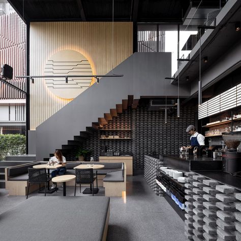 One of the most eye-catching features is the large wooden disc displayed on the staircase wall Restaurant Design Small, Interior Design Minimalist, Coffee Shop Interior Design, Design Café, Modern Cafe, Space Craft, Coffee Places, Coffee Shops Interior, 카페 인테리어 디자인