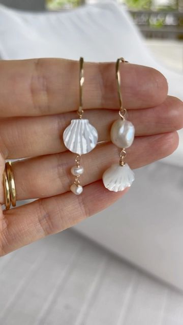 JAMES MICHELLE JEWELRY on Instagram: "🐚 NEW 🐚 Limited Release: Calypso Earrings✨ These handmade beachy earrings feature freshwater pearls and our pearlescent clamshell beads. They are the perfect way to add a little touch of the sea to any day. 🌊 Just like our NEW Calypso Necklace, these earrings are a limited run, so don't miss out!🌴 #jamesmichelle #jewelrydesign #jewelryaddict #jackjohnson #jewelry #jewelrydesigner #handmadejewelry #customjewelry #beachjewelry #ocean #sand #surf #starfish Beachy Pearl Jewelry, Beachy Boho Earrings, Shell And Pearl Jewelry, Shell Pearl Earrings, Pearl Shell Jewelry, Ocean Jewelry Diy, Homemade Shell Jewelry, Handmade Beach Jewelry, Self Made Jewelry Ideas