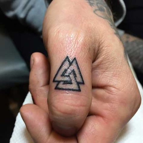 Viking Tattoo Designs, Ideas and Meanings - Tattoo Me Now Men Finger Tattoos, Valknut Tattoo, Runes Tattoo, Viking Tattoos For Men, Traditional Viking Tattoos, Herren Hand Tattoos, Thumb Tattoos, Viking Tattoo Symbol, Vikings Tattoo