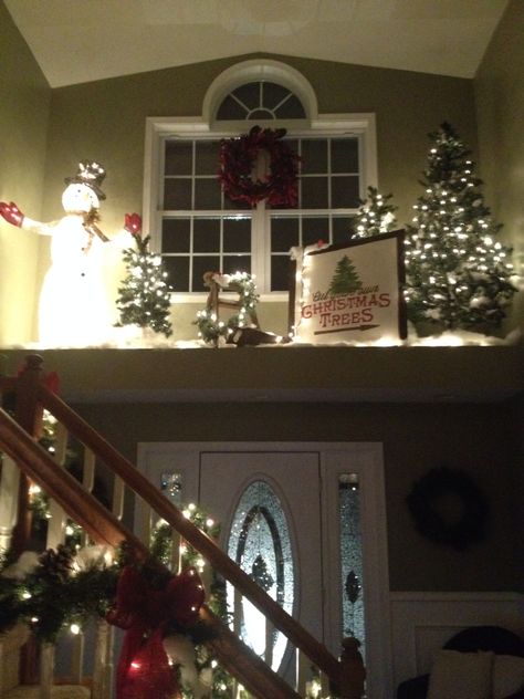 Christmas plant ledge Plant Ledges Living Room, Large Window Ledge Decor, Alcove Christmas Decor, Plant Ledge Christmas Decorating, Above Door Christmas Decor, Foyer Window Ledge Decor, High Shelf Christmas Decorating, Christmas Window Ledge Decor, Foyer Ledge Decorating Ideas Christmas