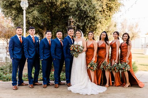 Navy Blue Burnt Orange Burgundy Peach Wedding, Navy Blue And Orange Groomsmen Suits, Rust Navy Burgundy Wedding, Rustic Orange Wedding Bridesmaid Dress, Navy Blue Suit With Rust Tie, Terracotta Rust And Navy Blue Wedding, Navy Orange Green Wedding, Orange And Blue Rustic Wedding, Burnt Orange And Blue Bridesmaid Dresses