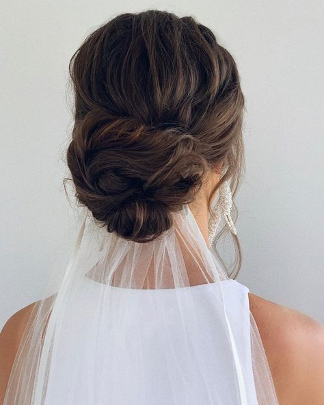 Veil Low Bun Wedding, Updo Hairstyles Wedding With Veil, Veil Placement Updo Low Buns, Wedding Veil Below Bun, Wedding Bun And Veil, Low Romantic Bun Brides, Veil Under Low Bun, Under Veil Hairstyles, Wedding Hairstyle Low Bun With Veil