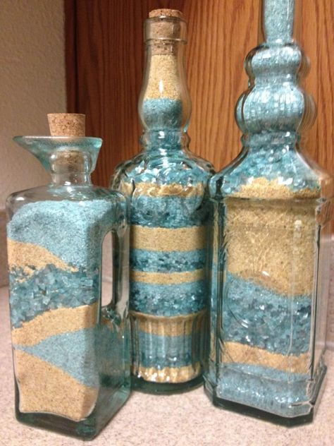 Adult sand art! I bought decorative glasses from Pier 1 and filled them with sand and tiny glass pieces from Michaels. They match my kitchen! Sand In Glass Bottles, Sea Glass Bottles Decor, Sand Art For Adults, Sand Glass Art, Sand Crafts For Adults, Sand Bottle Ideas, Sand Bottle Art, Sand Art Bottles Diy, Bottle Sand Art