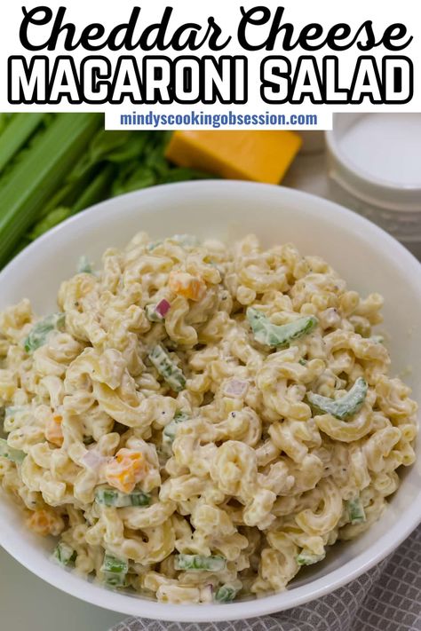 Cheddar macaroni salad is a timeless dish packed with flavor! This recipe combines cooked elbow macaroni with sharp cheddar cheese, chopped celery, and diced red onion. A creamy dressing made with mayonnaise, sour cream, and a hint of Dijon mustard brings it all together. It's the perfect side dish for summer picnics, or your next potluck or backyard bbq! Sour Cream And Cheddar Macaroni Salad, Cheddar Macaroni Salad, Garden Pasta Salad, Macaroni Pasta Salad, Cheddar Cheese Recipes, Slaw Dressing, Honey Lime Chicken, Pecan Salad, Creamy Dressing