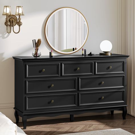 PRICES MAY VARY. Modern Charm: Chic and modern, this wood dresser showcases a classic black finish, metal handles, a wavy bottom, and distinctively shaped wooden legs. It effortlessly enhances any decor, bringing a refined and elegant touch to your space. Ample Storage: With 7 roomy drawers and smooth-gliding slides, organizing clothes, cosmetics, photo albums, and personal items becomes effortless. The top surface serves as the perfect spot for displaying plants, books, or decor, keeping the ro Displaying Plants, Organizing Clothes, Dresser For Bedroom, Drawers Dresser, 7 Drawer Dresser, Wood Dresser, Wooden Leg, Paint Finish, Photo Albums