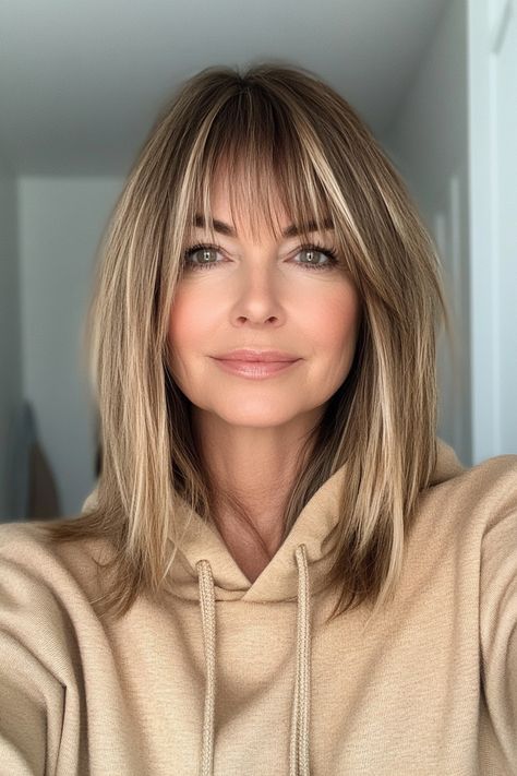 23. Long Layered Bob with Straight Bangs in Light Caramel (Hairstyles For Women Over 50 With Bangs) - Hairstyles For Women Over 50 With Bangs Caramel Hairstyles, Bob With Straight Bangs, Over 50 Bangs, Women Over 50 With Bangs, Over 50 With Bangs, Long Bob Haircut With Layers, Long Layered Bob, Medium Hair Styles For Women, Haircuts For Medium Length Hair