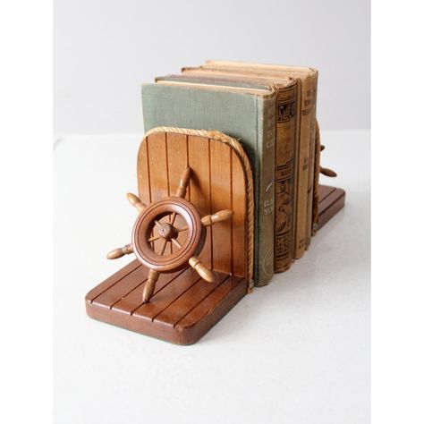 Sail the high seas, without ever leaving your bookshelf! These vintage ship wheel bookends will add a splash of fun and nautical charm to your library. Crafted with wood frames and rope trim, these stylish bookends come complete with convenient felt bases, perfect for keeping your books afloat. Ahoy, matey! Nautical Vintage Decor, Sailboat Nursery Baby Boy, Vintage Nautical Nursery, Nautical Nursery Theme, Boat Bookshelf, Ship Mobile, Ocean Baby Rooms, Sailor Room, Boat Nursery