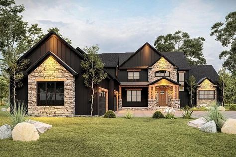 Architectural Designs on Instagram: "Tell us your favorite thing about this new plan! 🤩🖤⁠ ⁠ Introducing Architectural Designs Exclusive Craftsman Plan #911023JVD - we are obsessed with this exterior!⁠ ⁠ The master bedroom occupies the right side of the main level and features an ensuite with a large walk-in closet. A home office completes the main level.⁠ ⁠ ⁠ 🖤 4,728 Sq Ft⁠⁠ 🖤 5 Bedrooms⁠⁠ 🖤 4 Bathrooms⁠⁠ 🖤 4 Car Garage⁠⁠ 🖤 79'-6" Wide x 111'-0" Deep⁠⁠ ⁠ Check out the Link in Bio or www.a Black Ranch Style House Exterior, Burnished Slate Barndominium Exterior, Single Story Exterior Design, L Shaped Homes Exterior, L Shaped Houses Exterior, French House Exterior, Modern Stone House Exterior, Black And Cedar House Exterior, Bloxburg Houses