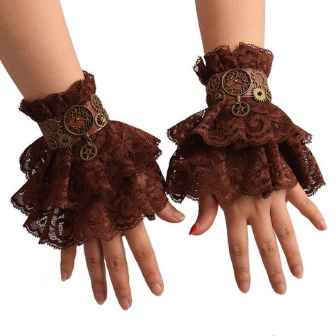 Apprêtez vous de ces Gants Steampunk pour Femme au style délicieusement victorien.  Des gants en dentelle serties d'engrenages et d'éléments industriels rétro-futuriste.  Simples et efficaces, ils apportent à toute tenue de soirée ou de cosplay, un effet  terriblement punk et industriel à vos tenues rock, vintage ou même gothique. L'idéal pour affirmer son style en combinaison avec d'autres éléments rétro, comme une robe ou un chapeau.  Un point sur les gants steampunk : voilà un accessoire qui Steampunk Fashion Everyday, Steam Punk Diy, Steampunk Fashion Women, Steampunk Medieval, Steampunk Mode, Steampunk Gloves, Moda Steampunk, Pola Lengan, Mode Steampunk