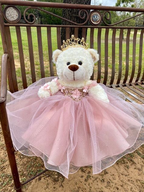 Ideal bear for your quinceanera party, it measures approximately 17" Each dress of our bears is custom designed matching the tone to the color of your quinceanera dress. It is worth mentioning that the tone of the fabric may vary, as well as the accessories (crown, earrings or necklace) If you need a more personalized bear or the same as your dress, it can also be made. Our specialty is satisfying our clients. You can contact us if you require a custom design. Contact: 817-443-7252 FB: Norma Vazquez Fashion Designer https://www.facebook.com/profile.php?id=100077462744454 Quinceanera Bear, Quinceanera Teddy Bear, Blush Tulle Dress, Quinceanera Accessories, Rose Gold Quinceanera, Quince Themes, Quinceanera Dresses Gold, Quinceanera Pink, Pink Quince