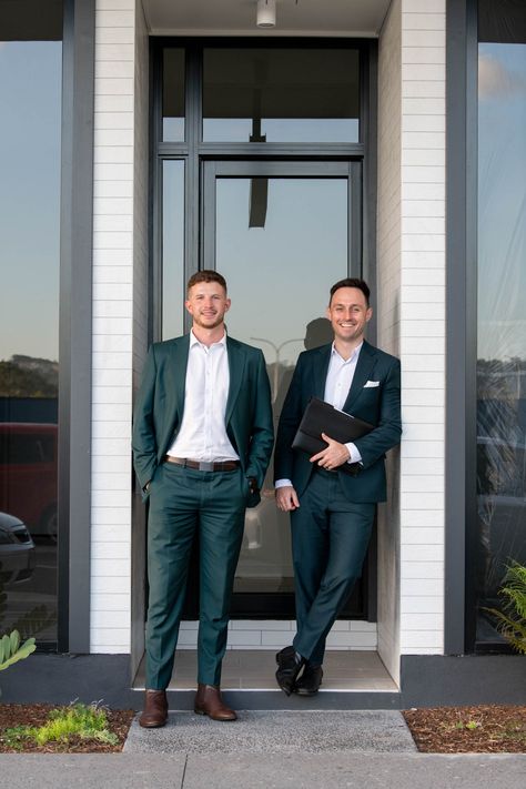 Two Gentlemen in Their Suits Standing Outside A Building Loan Officer Headshots, Male Real Estate Agent Aesthetic, Business Group Photos Outdoor, Real Estate Team Branding, Real Estate Agent Portraits, Office Shoot Ideas, Real Estate Lifestyle Photos Men, Business Partner Photoshoot Male Female, Real Estate Agent Photoshoot Men