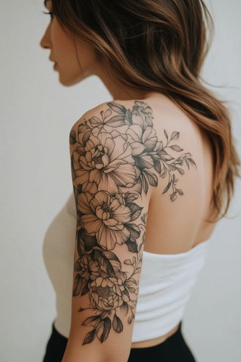 Discover the beauty of intricate floral designs with this stunning black-and-white shoulder tattooPerfect for those who appreciate the elegance of nature-inspired body artKeywordsfloral tattooshoulder tattooblack and white tattooflower tattooelegant tattoonature-inspired tattoofeminine tattoo. Black Floral Shoulder Tattoo, Over The Shoulder Floral Tattoo, Partial Sleeve Tattoo Women Shoulder, Peony Tattoo On Shoulder, Fantasy Floral Tattoo, Floral Tattoo Design Upper Arm, Women Tattoo Sleeve Ideas Classy, April And November Flower Tattoo, Floral Upper Arm Tattoo Half Sleeves